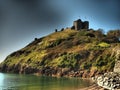 Sunset over Criccieth castle in North Wales in Gwynedde Royalty Free Stock Photo