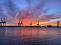 Sunset over Delaware River at Walt Whitman Bridge and Philadelphia Port