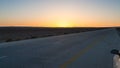 Sunset over Desert Highway Road 15 in Jordan Royalty Free Stock Photo