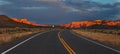 Sunset over a desert road Royalty Free Stock Photo