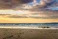 Sunset over a Deserted Sandy Beach Royalty Free Stock Photo