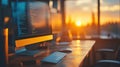 Sunset Over Desktop Computer with Coding Display Royalty Free Stock Photo