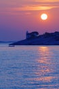 Sunset over desolate lighthouse on Murter island in Adriatic sea