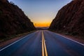 Sunset over distant mountains and Escondido Canyon Road, in Agua