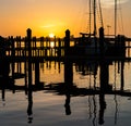 Sunset over dock and sailboat in Florida Royalty Free Stock Photo