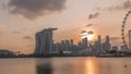 Sunset over the downtown skyline of Singapore as viewed from across the water from The Garden East timelapse. Singapore. Royalty Free Stock Photo