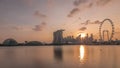 Sunset over the downtown skyline of Singapore as viewed from across the water from The Garden East timelapse. Singapore. Royalty Free Stock Photo