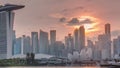 Sunset over the downtown skyline of Singapore as viewed from across the water from The Garden East timelapse. Singapore. Royalty Free Stock Photo