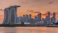 Sunset over the downtown skyline of Singapore as viewed from across the water from The Garden East timelapse. Singapore. Royalty Free Stock Photo