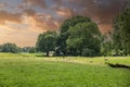 Sunset over Dutch ascended green polder landscape between Ter Aar and Alphen aan den Rijn Royalty Free Stock Photo