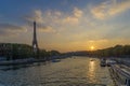 Sunset Over Eiffel Tower in Paris Seine River and Boats Cruises Trees and Clouds Royalty Free Stock Photo