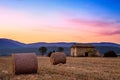 Sunset over farm field Royalty Free Stock Photo