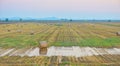 Sunset over farm field with hay bales in summer Royalty Free Stock Photo