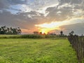 Sunset over a farm Royalty Free Stock Photo