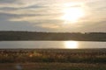 Sunset over field and river. Panorama sunset and sunrise, bank of the river Royalty Free Stock Photo