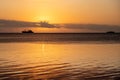 Sunset over fishing boats and commercial tankers, Tombeau Bay, Mauritius Royalty Free Stock Photo