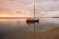 Sunset over fishing boats and commercial tankers, Tombeau Bay, Mauritius Royalty Free Stock Photo