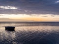 Sunset over fishing boats and commercial tankers, Tombeau Bay, Mauritius Royalty Free Stock Photo