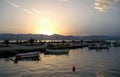 Sunset over fishing boats in the harbor at Nafplio in Greece Royalty Free Stock Photo