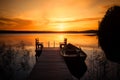 Sunset over the fishing pier at the lake in Finland Royalty Free Stock Photo