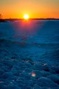 Sunset over a frozen beach in Petoskey Michigan