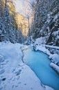 Sunset over frozen creek in Sucha Bela gorge in Slovak Paradise during winter Royalty Free Stock Photo