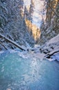 Sunset over frozen creek in Sucha Bela gorge in Slovak Paradise during winter Royalty Free Stock Photo