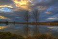 Sunset over the frozen lake - picture during early winter Royalty Free Stock Photo