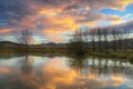 Sunset over the frozen lake - picture during early winter