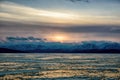 Sunset over frozen lake. Winter landscape of Mongolia. Royalty Free Stock Photo