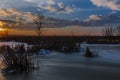 Sunset over frozen lake Royalty Free Stock Photo