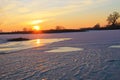 Sunset over the frozen river Dnieper Royalty Free Stock Photo