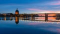 Sunset over Garonne River, with reflections of Saint-Pierre Bridge and Chapel of hÃÂ´pital Saint-Joseph de la Grave, in Toulouse,