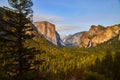 Sunset over the gorgeous Yosemite Tunnel View of entire valley with pine tree in foreground Royalty Free Stock Photo