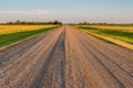 Sunset over a gravel road on the Saskatchewan prairies Royalty Free Stock Photo
