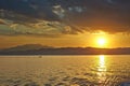 Sunset over the Greece, waves from the ferry, and Royalty Free Stock Photo