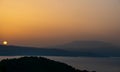 Sunset over the Greek mainland. Warm holiday picture taken from Skiathos Royalty Free Stock Photo