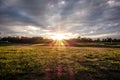 Sunset over green farm Royalty Free Stock Photo