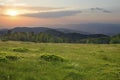 Sunset over green field Royalty Free Stock Photo