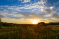 Sunset over green fields Royalty Free Stock Photo