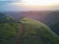 Sunset over green hills landscape Royalty Free Stock Photo