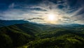 Sunset over green hills and mountains Royalty Free Stock Photo