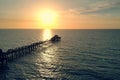 Sunset over the Gulf of Mexico, flying above pier Royalty Free Stock Photo