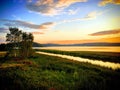 Sunset over the Halikonlahti bay and Halikonjoki river shore near Salo, Finland, July 2018 Royalty Free Stock Photo