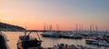 sunset over the harbor in Porto Santo Stefano in Tuscany in Italy Tyrrhenian sea and boats Royalty Free Stock Photo