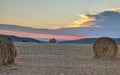 Sunset over harvested wheat fields Royalty Free Stock Photo