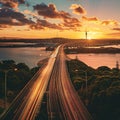 Sunset over highway bridge with city skyline Royalty Free Stock Photo