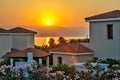 Sunset over holiday beach villas Royalty Free Stock Photo