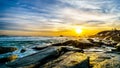 Sunset over the horizon of the Atlantic Ocean at Camps Bay near Cape Town Royalty Free Stock Photo