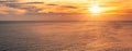 Sunset over horizon on tropical sea with boat Royalty Free Stock Photo